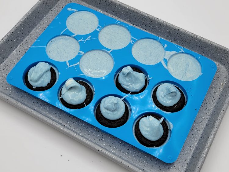 Covering the Oreos with chocolate